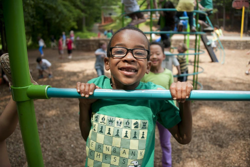 boy in green crew neck t shirt wearing black framed eyeglasses